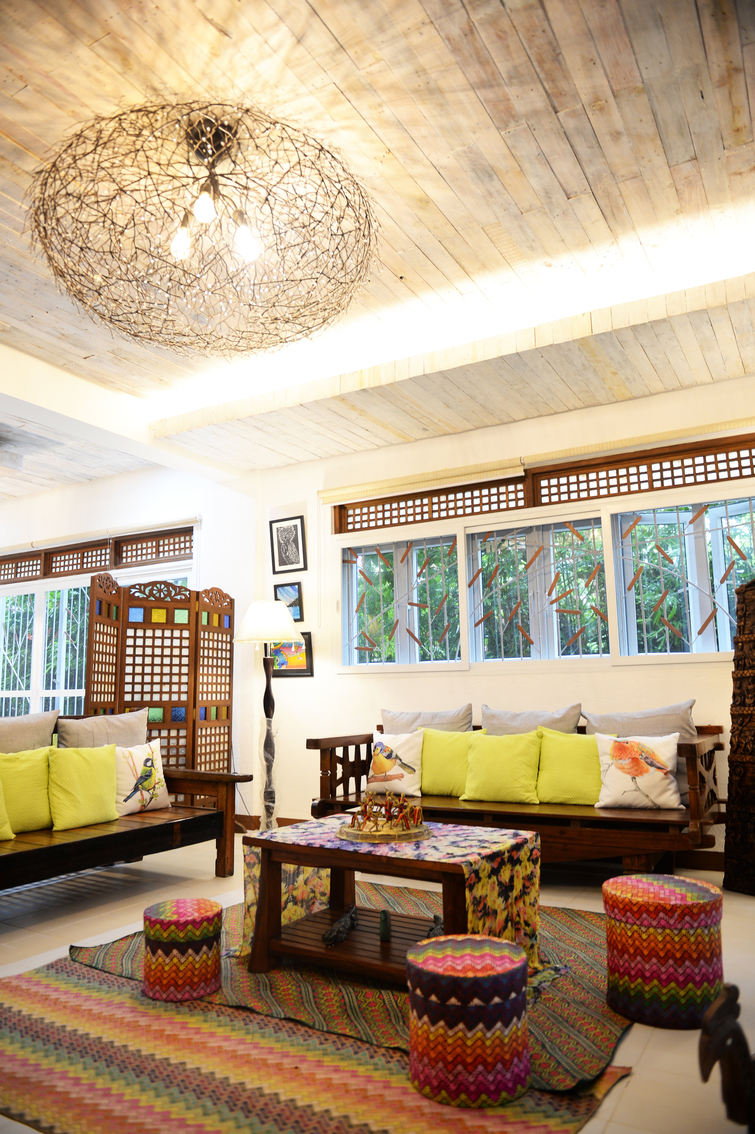 Metal drop light on palo china ceiling