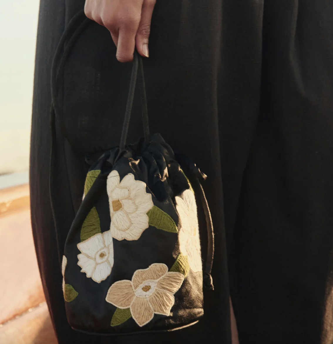 The Great Embroidered Cinched Bucket Bag in Black