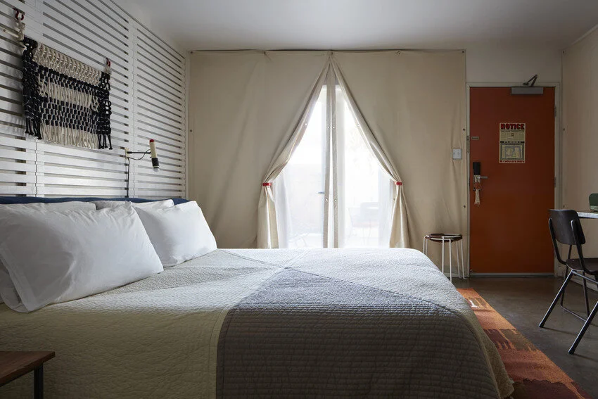 These rooms have a king bed, a bathroom with shower and amenities by Rudy’s Barbershop, flat screen TV and a Music Hall radio.