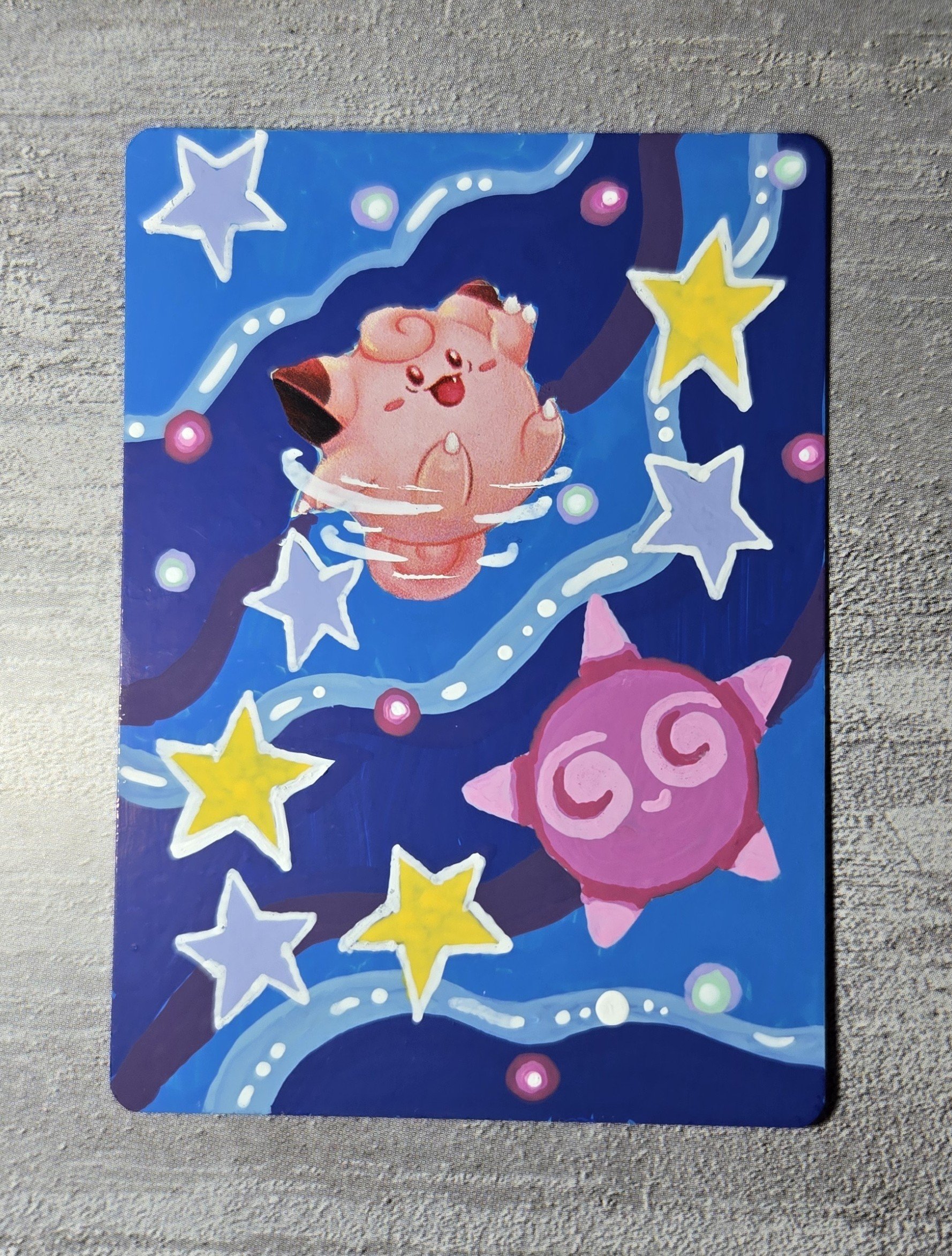 Clefairy : I painted her hanging out in the stars with her friend Minior, dancing in space.