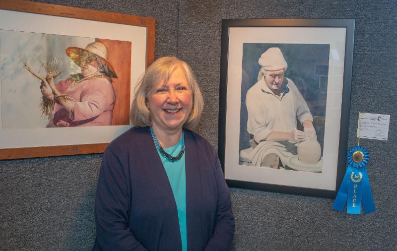 Donna Finnegan won Spotlight's first place for her watercolor "The Potter"