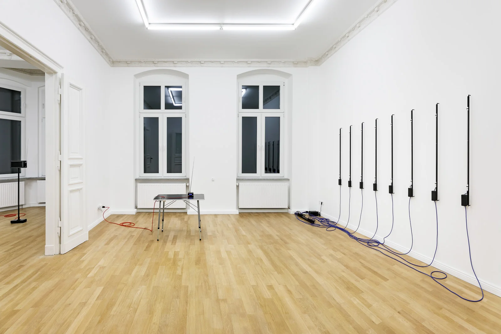 Installation view, Christopher Aque, Red-blooded, White-skinned, and the Blues Left to Right: Transmission , 2018; Transmission , 2018 (FM transmitter); Erasure (en masse) , 2018