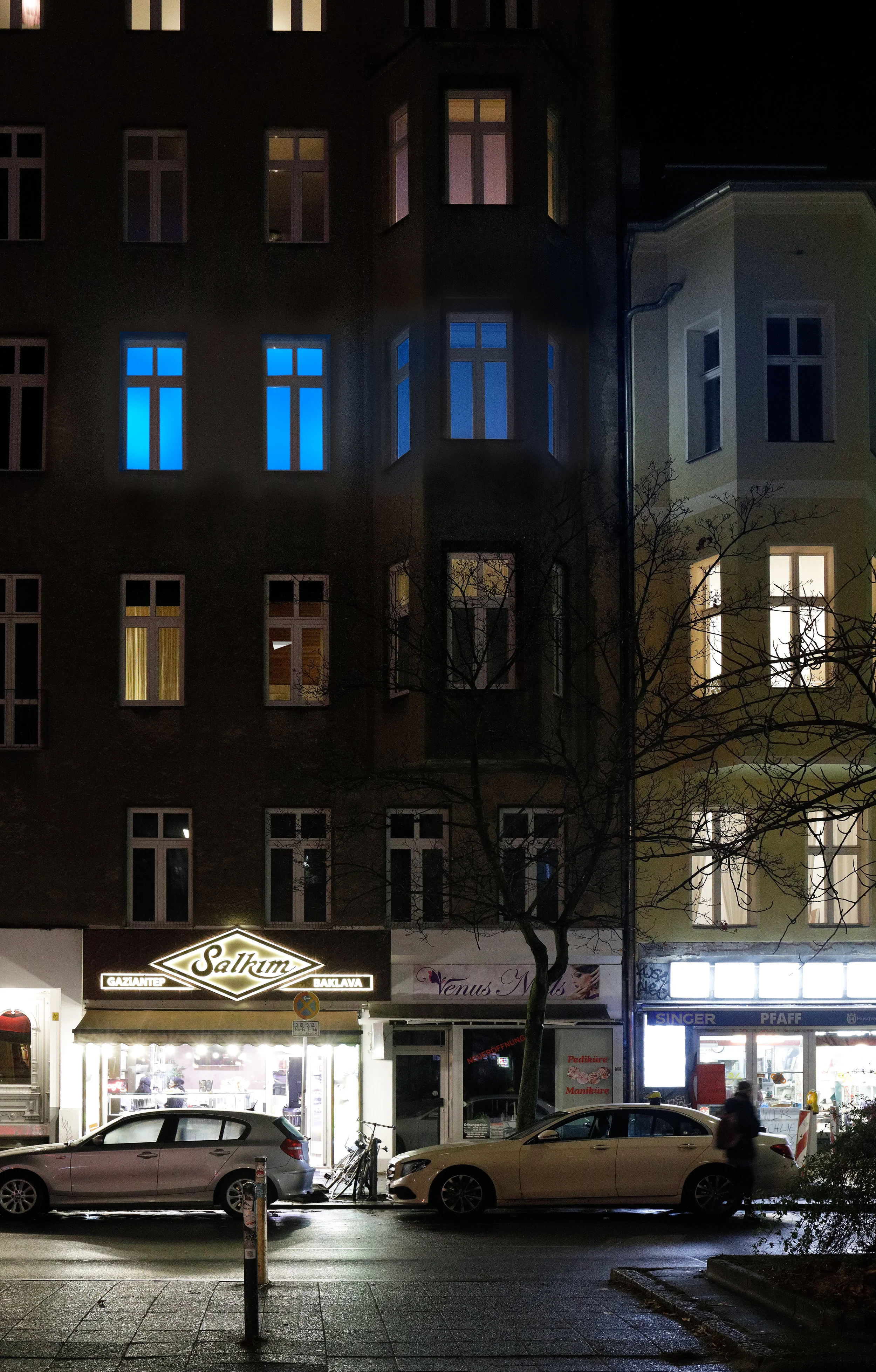 Installation view, Christopher Aque, Red-blooded, White-skinned, and the Blues Erasure (en masse) , 2018 (lights activated as seen from street)