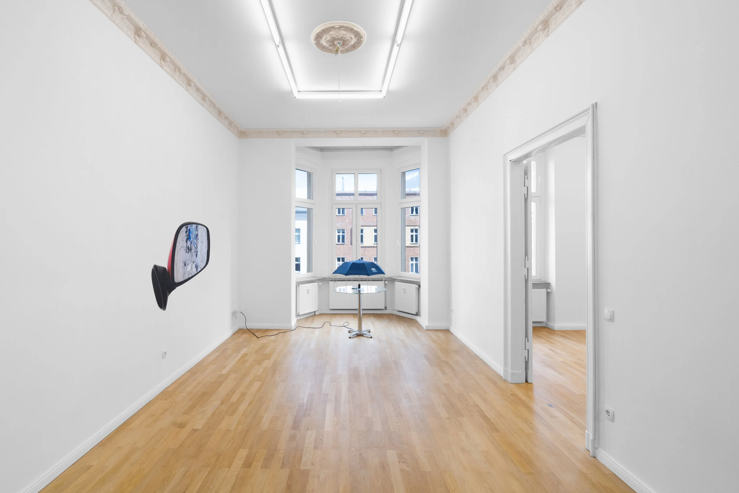 Installation view, Andrew J. Greene, Madeline Hollander, Asha Schechter Left: Asha Schechter, Prius mirror from Baby Barcelona , 2019 Center: Andrew J. Greene, Umbrella Dryer (Goldman Sachs) , 2017/2019