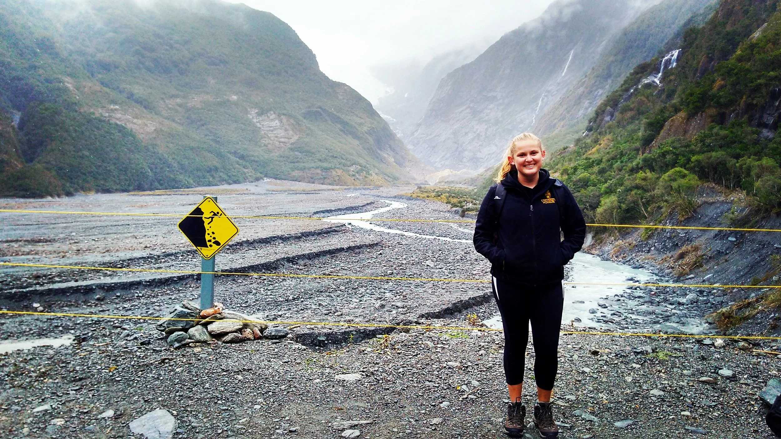 Dendra in New Zealand hiking up to the Franz Josef Glacier (rocking her jacket from U of Guelph as usual).