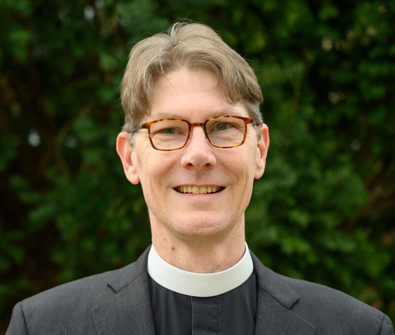 The Rev. Scott Gunn, Episcopal priest and author, smiling in clerical collar