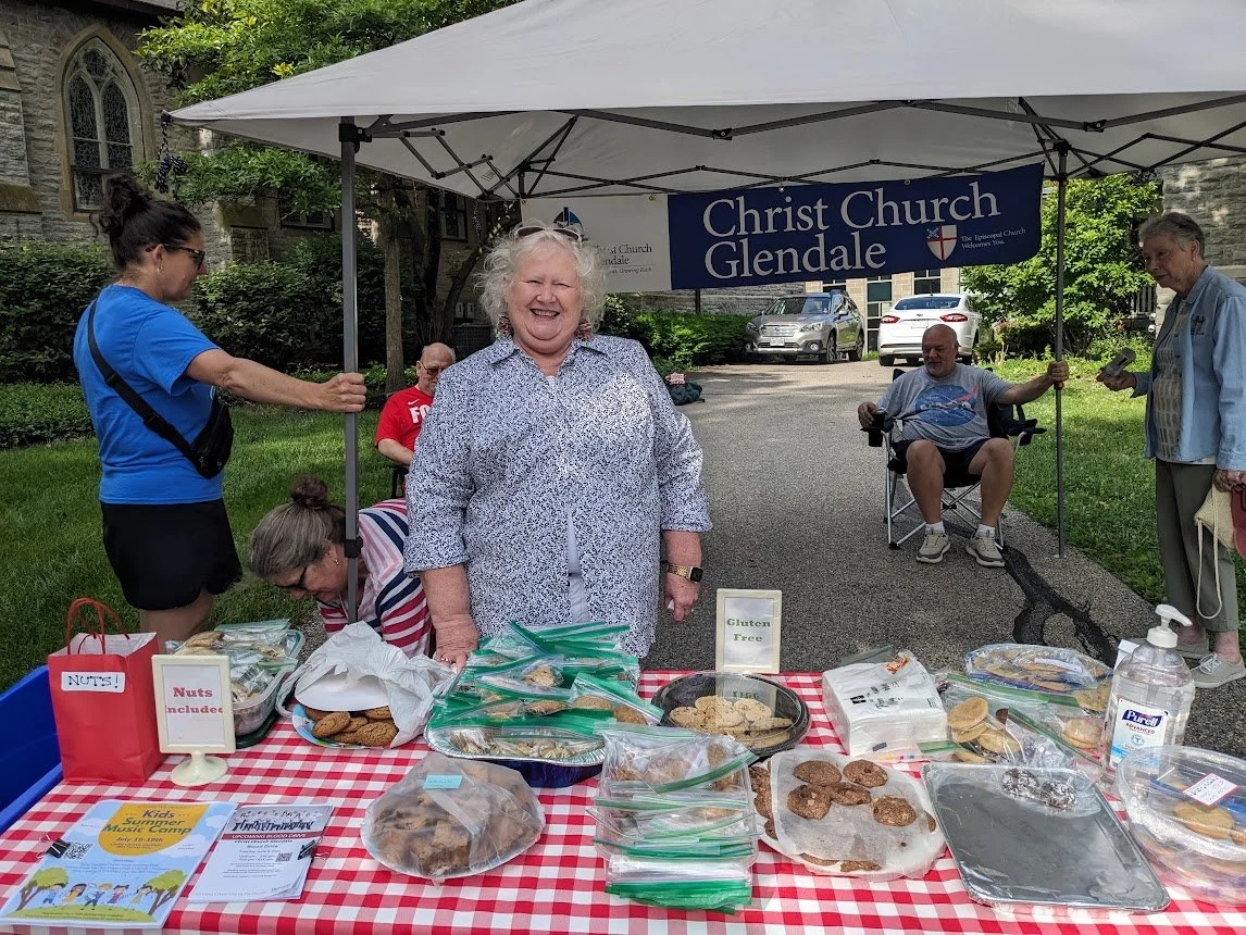A group of volunteers pass out cookies for Glendale's Memorial Day Parade