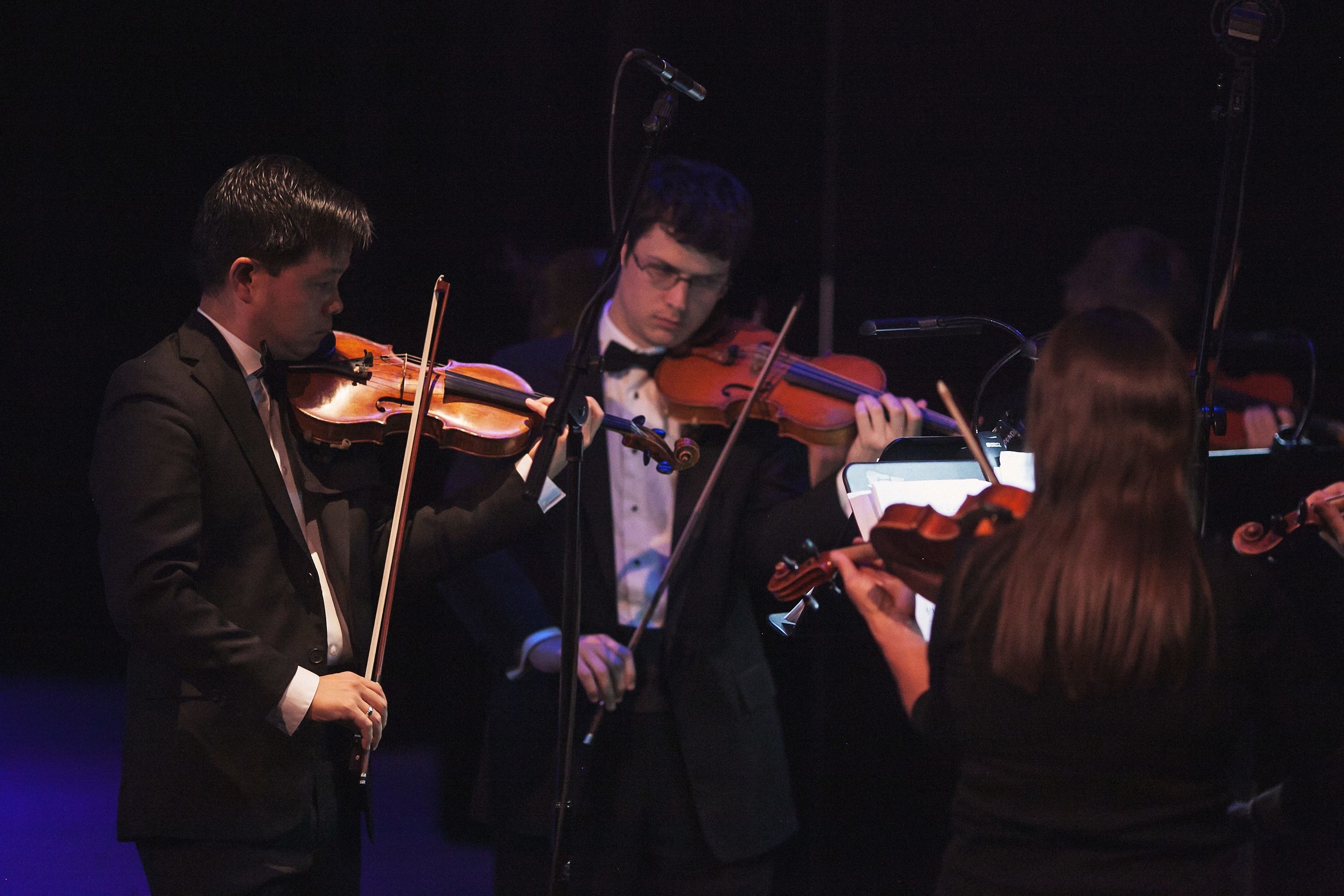 The Colorado Symphony's Claude Sims and musicians in Garrett Ammon's Seven Deadly Sins . Photo by Amanda Tipton. 2016.