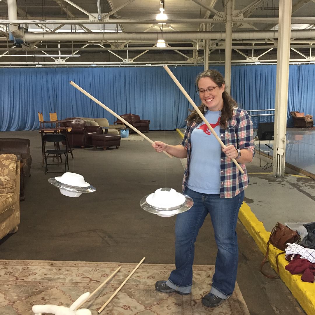 Wonderbound's Production Manager Eleanor Moriarty with UFO props for Garrett Ammon's 'Celestial Navigation.' Photo by Amanda Tipton . 2017.
