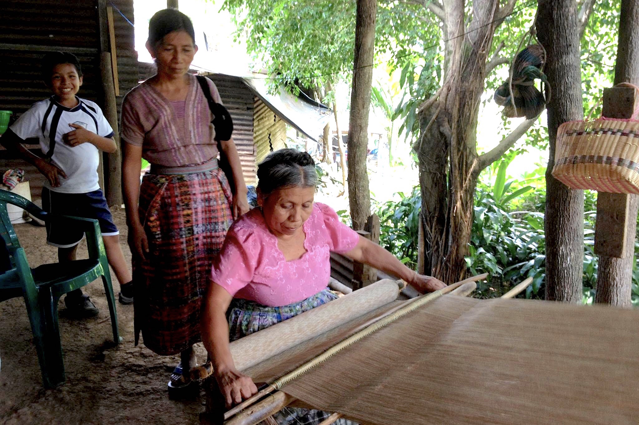 Maria Elena usign the cintron or belt weaving.jpg
