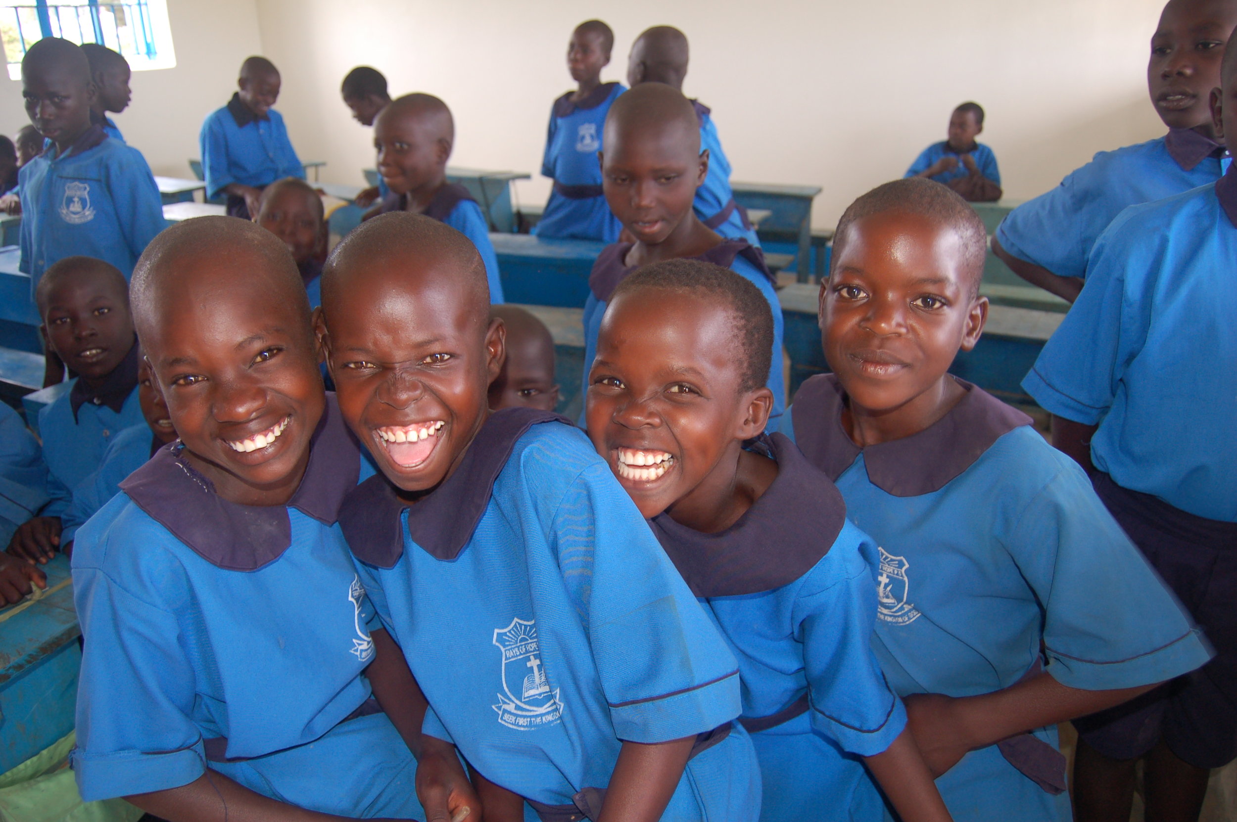 Children in Uniform Laughing.JPG