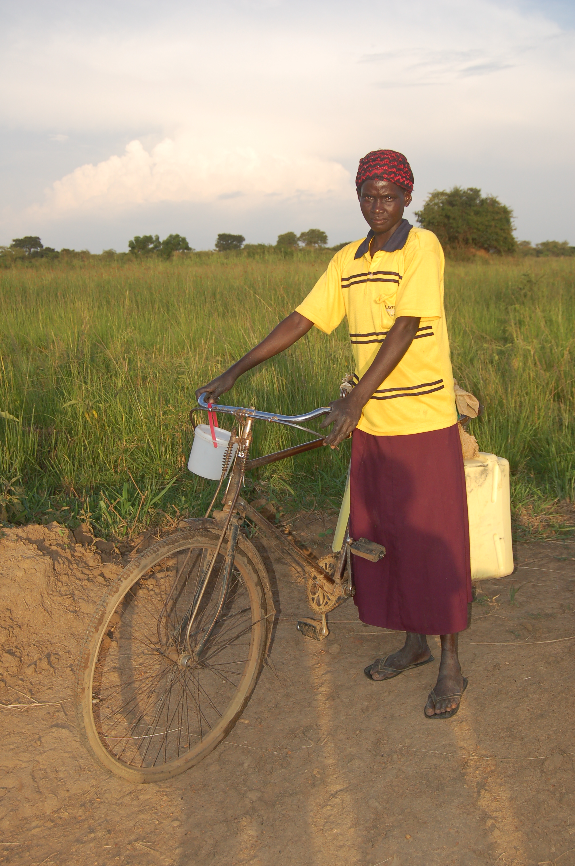 Village woman + bicycle.JPG