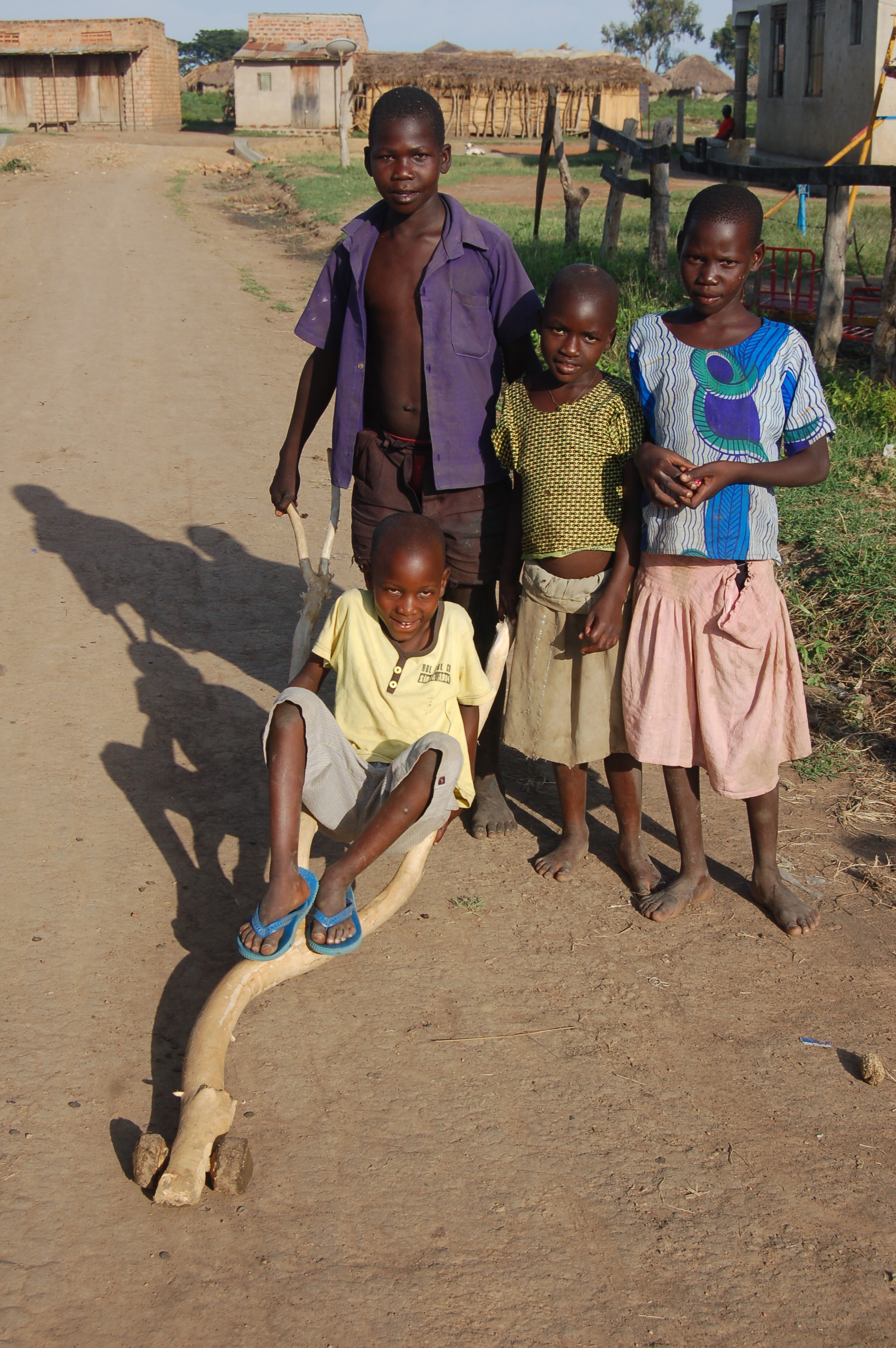 Four Children + makeshift wheel barrow.JPG
