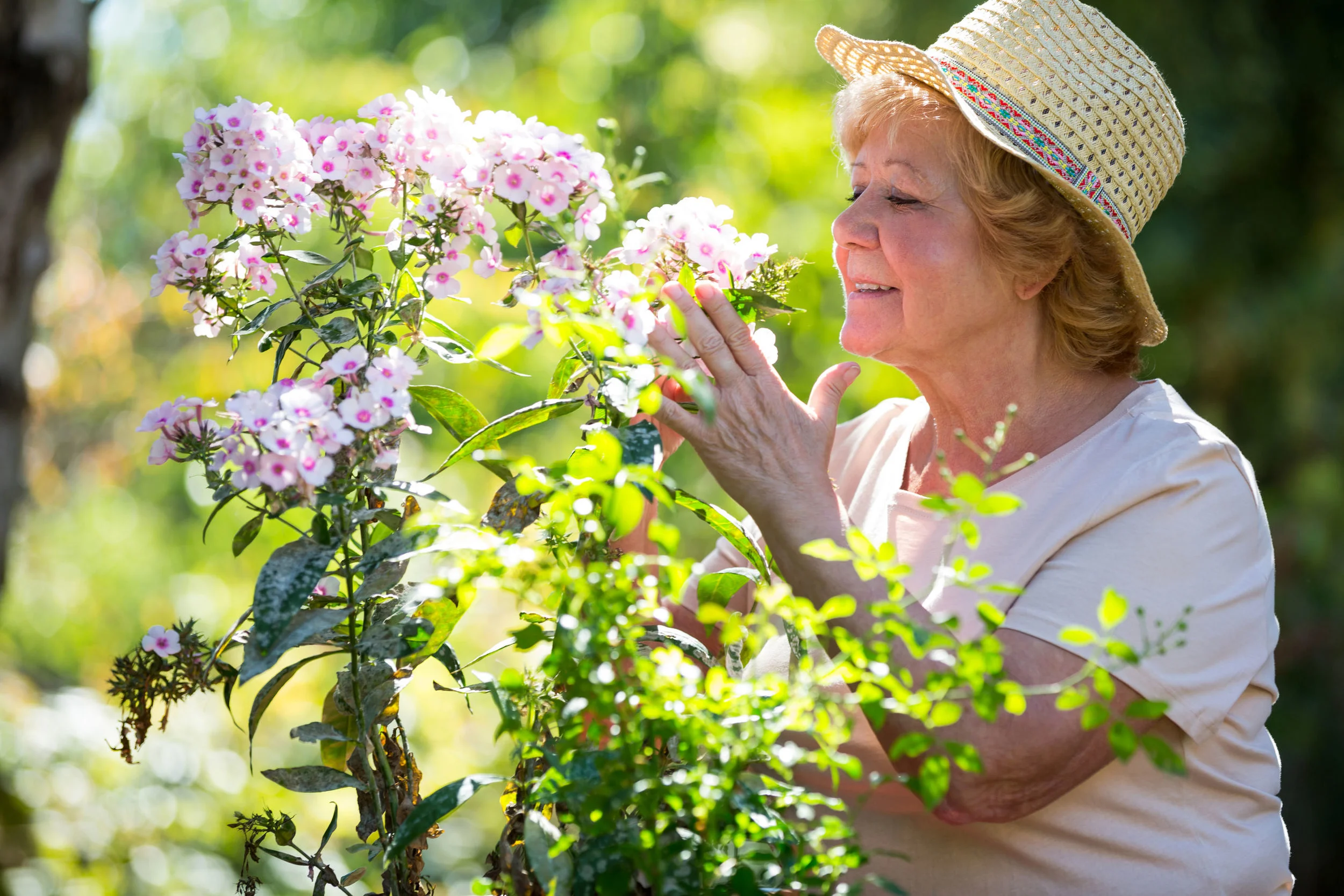 Senior Woman Smelling Flowers.jpg