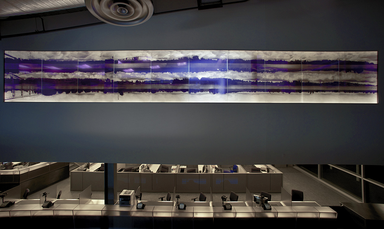 An award-winning, GSA-commissioned public artwork for the U.S. Port of Entry in Massena, NY, consisting of panoramic views of the four St. Lawrence River shorelines and three entities—Canada, Akwesasne Mohawk Territory, and the United States—at the