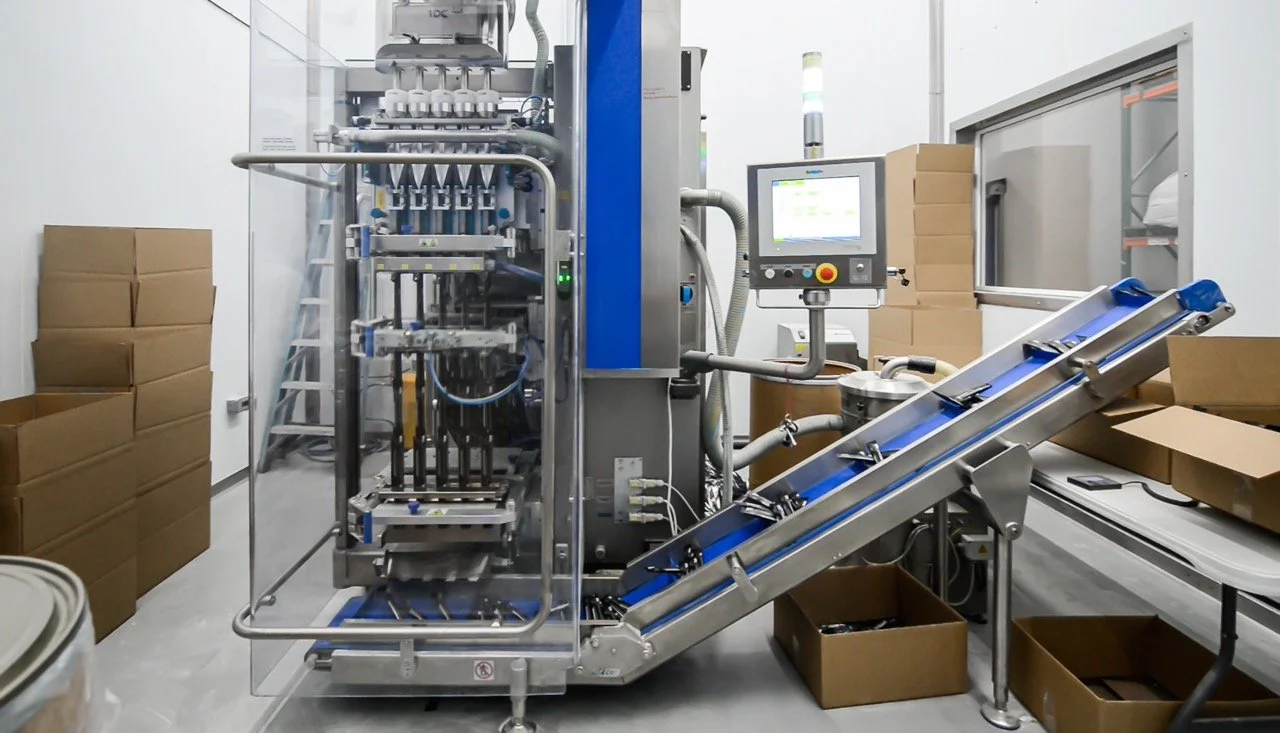 Image of a multi-lane VFFS stick packing machine at Nutra Connection's manufacturing facility in Utah.