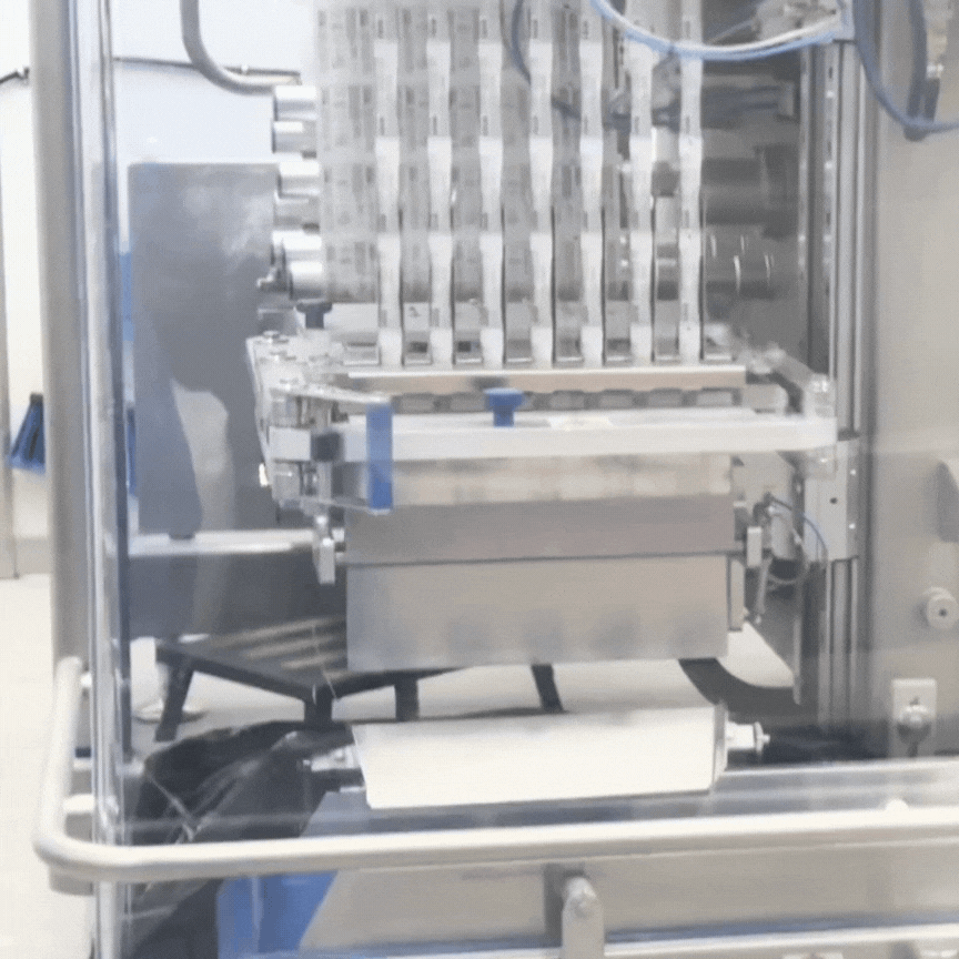A GIF showing the multi-lane stick pack manufacturing machine cutting off the completed sticks