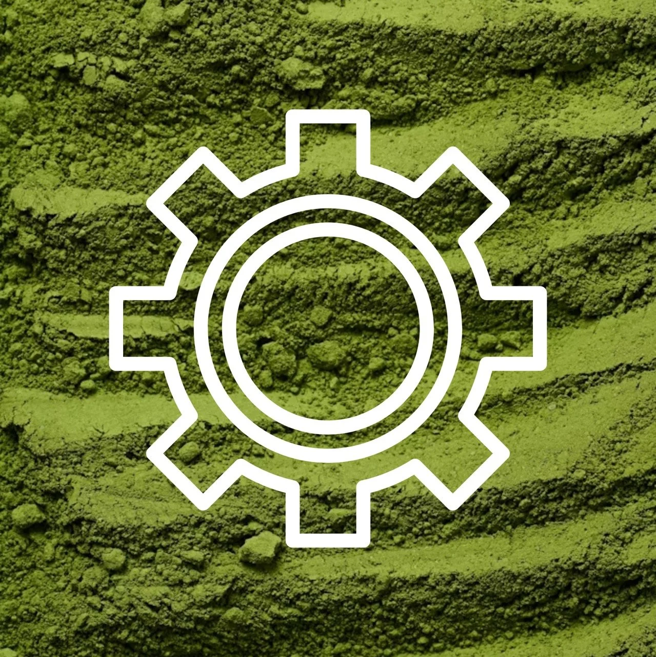 A gear/manufacturing icon over a pile of green powder.