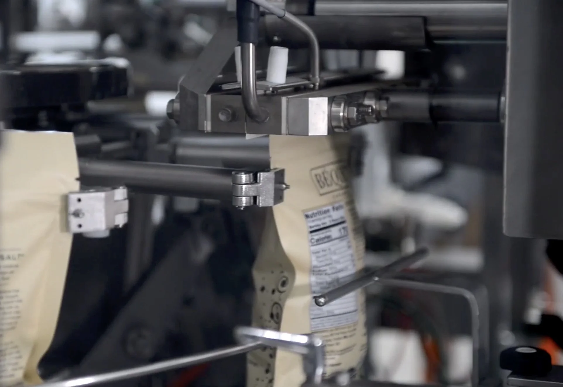 Pouches being heat sealed by our co-packing equipment.