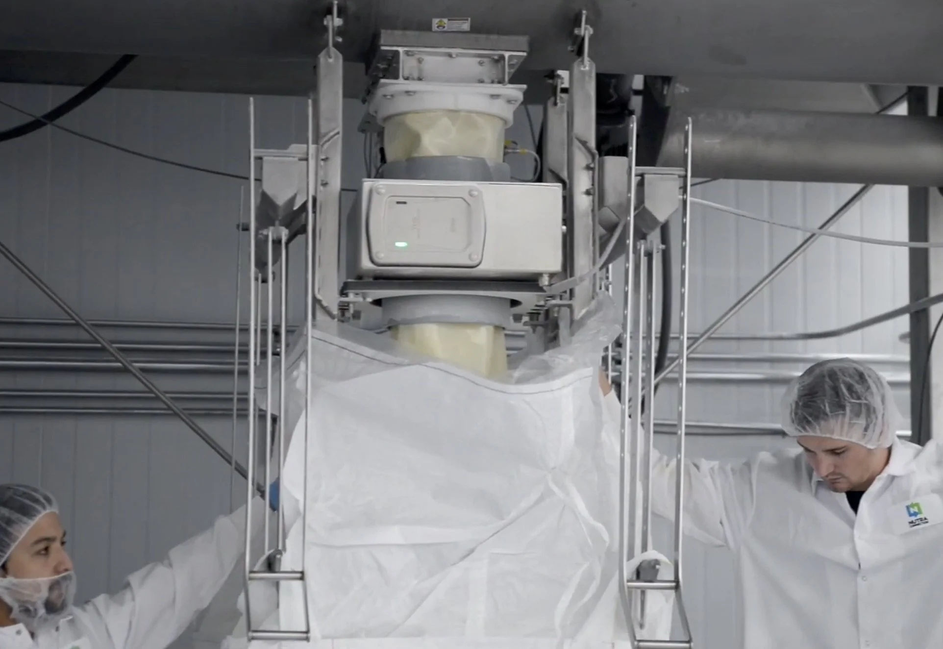 Blended batch being removed from our Paddle Fluidizer Blender