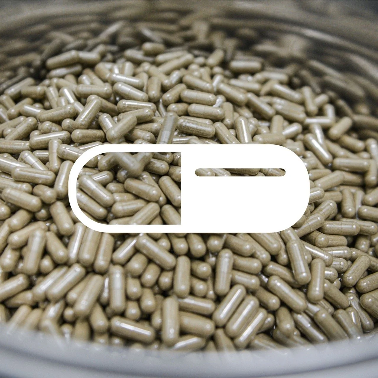 An icon of a capsule over a picture of many supplement capsules.