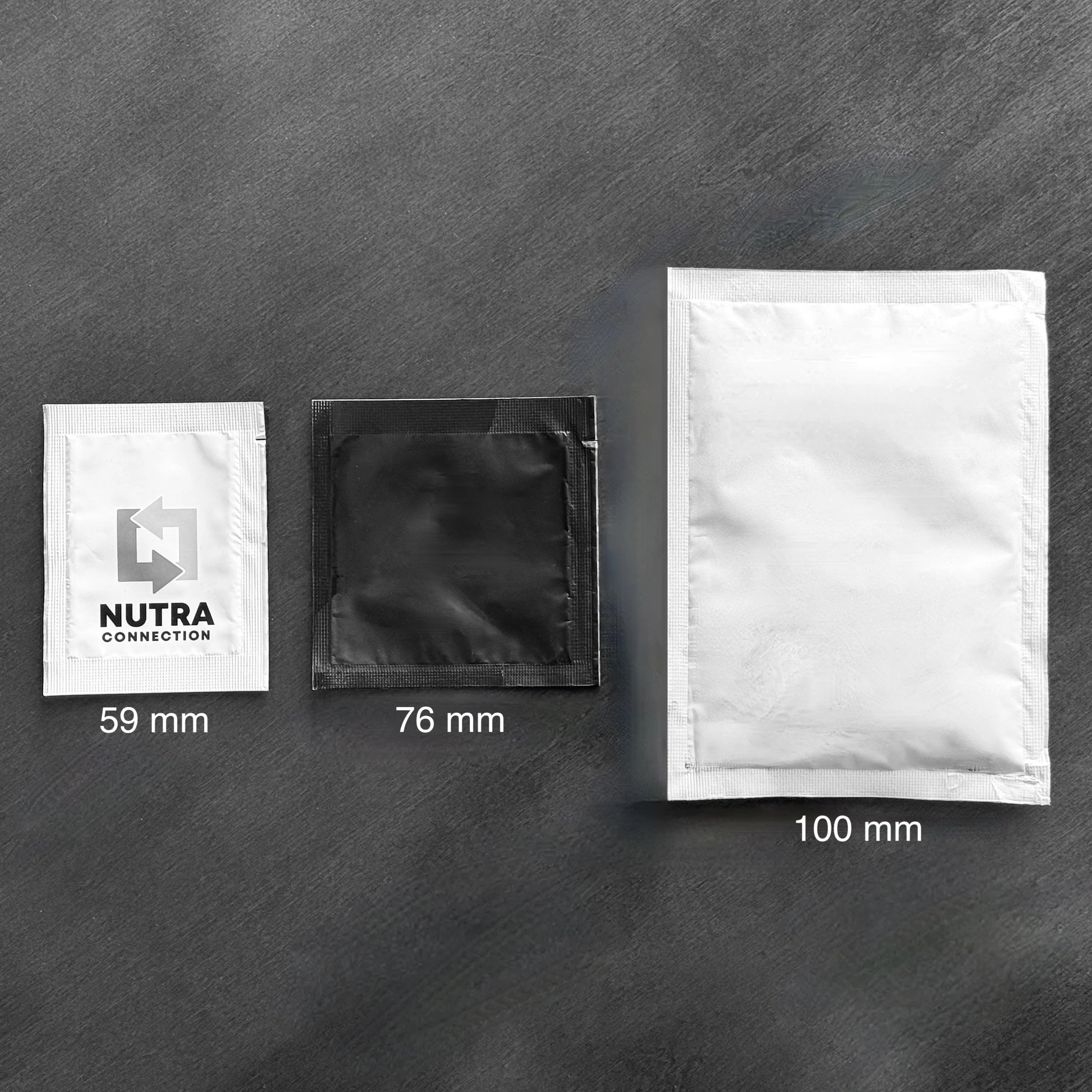 Three sachets demonstrating the widths of 59 mm, 76 mm, and 100 mm.