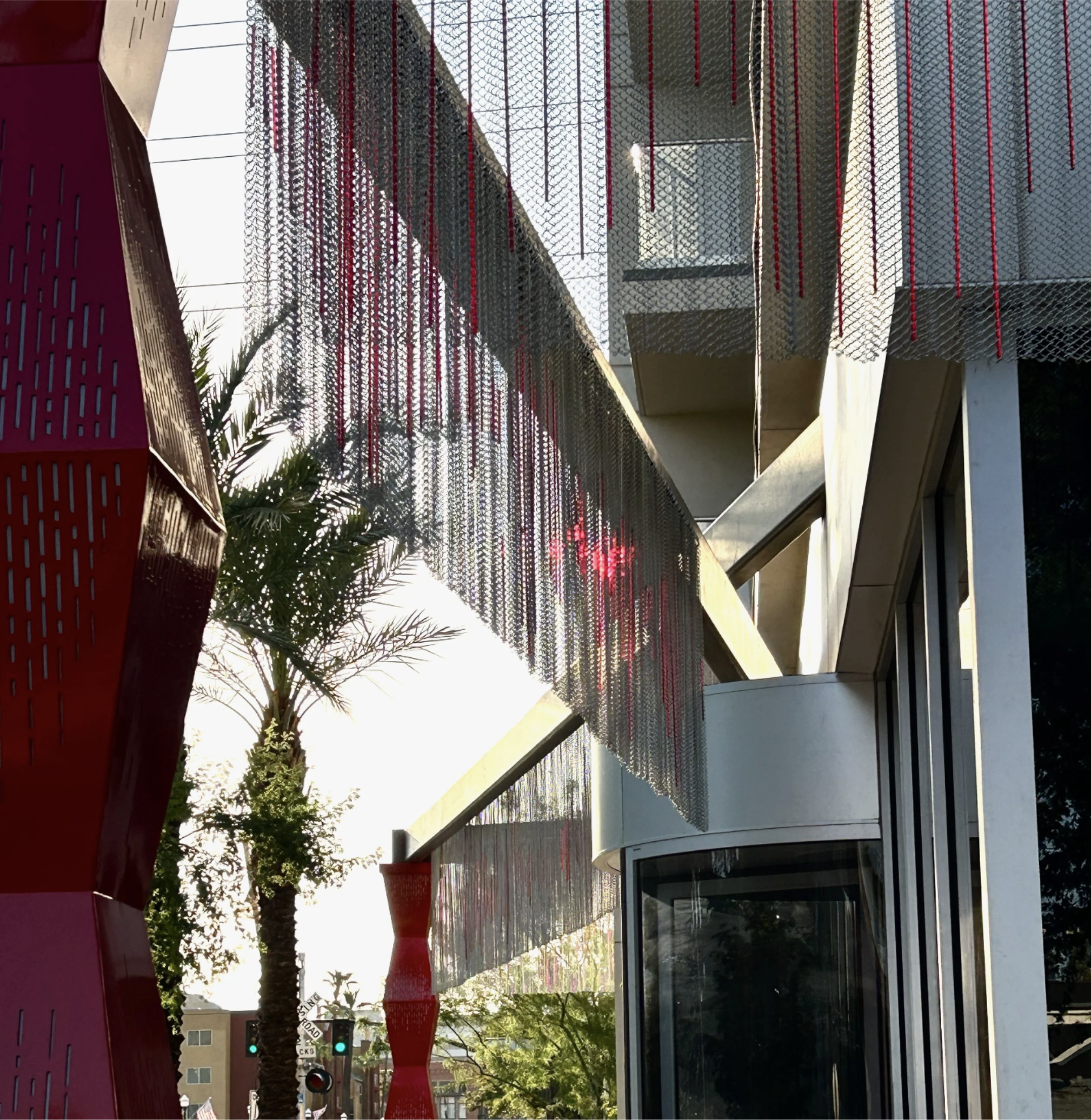 A sound graph of spoken words is woven into the stainless steel fabric surrounding the Vīb Hotel.