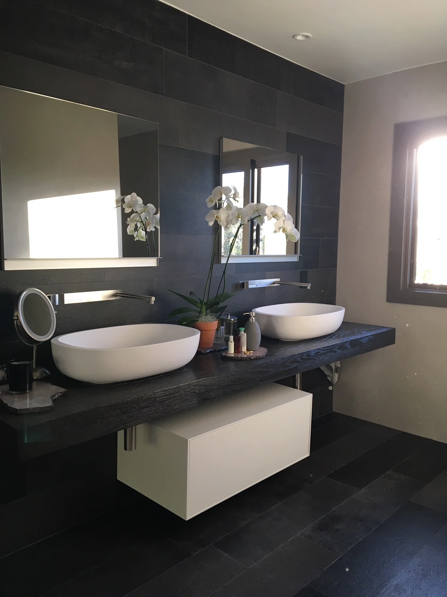  BEACHWOOD RESIDENCE  Full gut and remodel. Custom Vanity combined with Boffi furnishings. Charcoal porcelain tile from floor to ceiling and wall to wall. Surrounding walls clad with porcelain slabs.   BEFORE | AFTER    