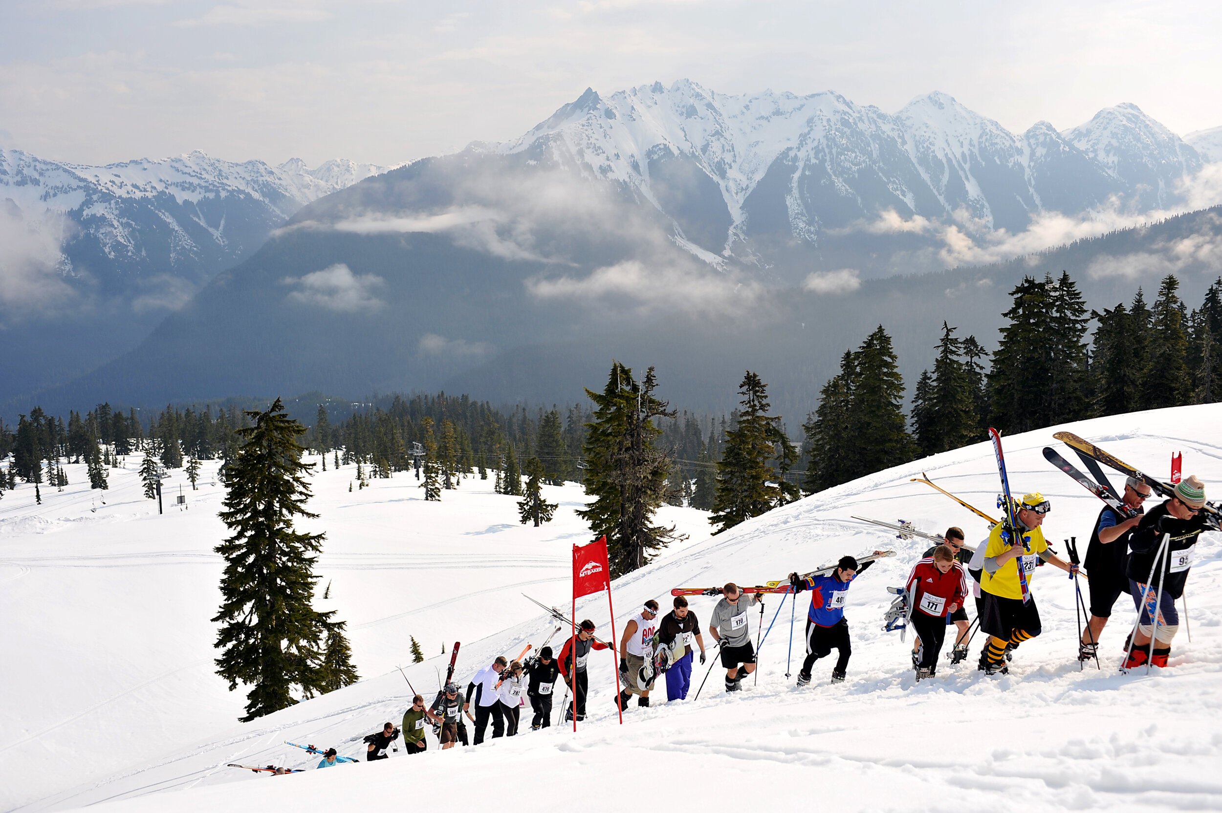  Downhill skiers and snowboarders make their way through the second leg of the 100-mile Ski to Sea race Sunday, May 29, on Mount Baker. 