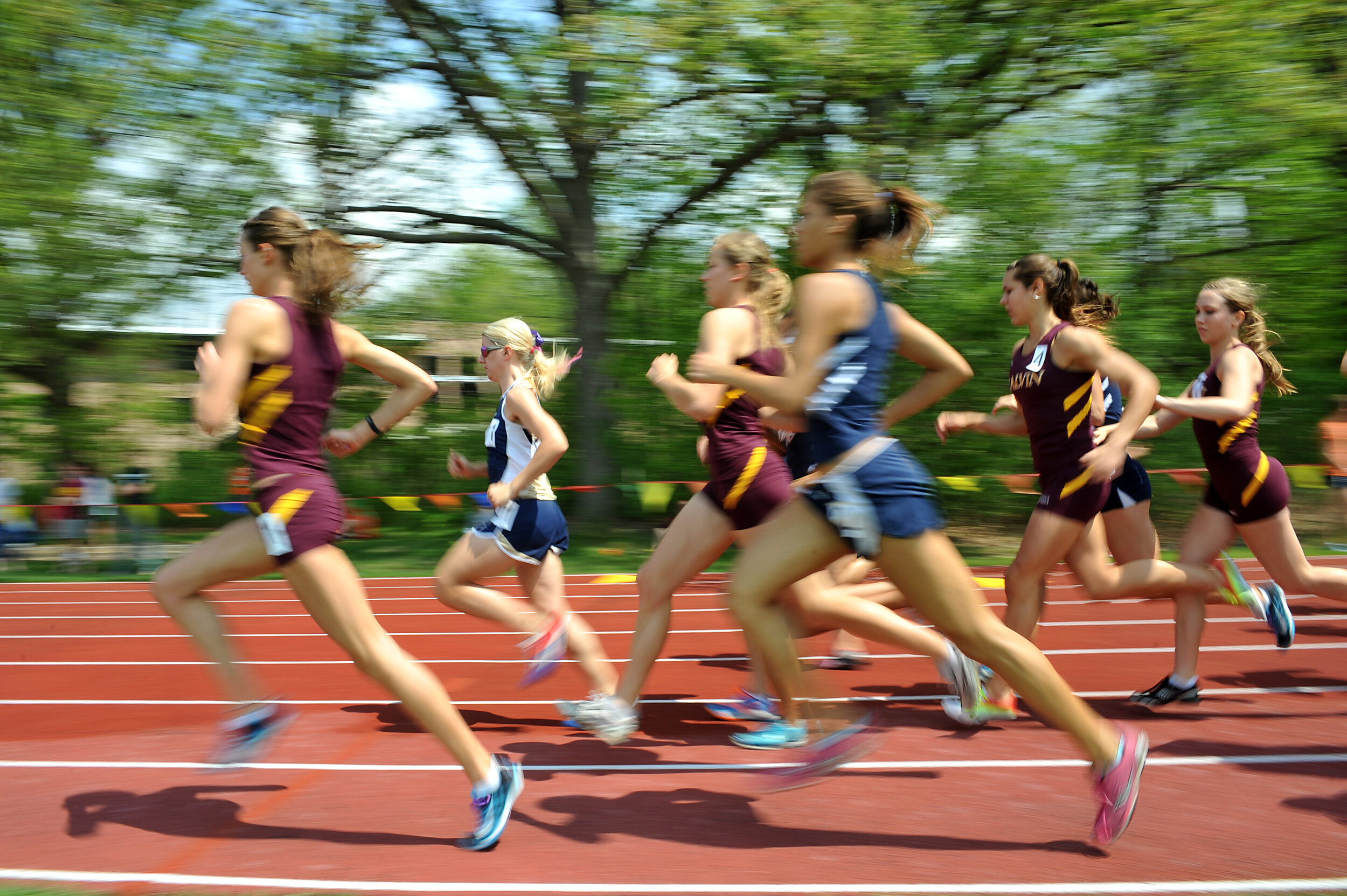  Women compete in the 1,500-meter run during the MIAA track championships Friday, May 4, at Calvin College. 