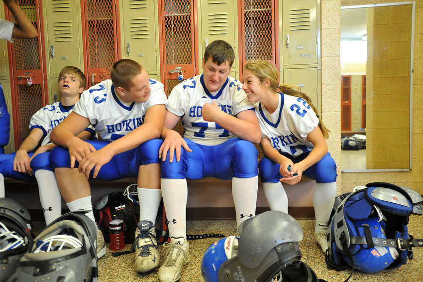  Keara Kilbane, right, talks with Zeb Striegle, center, and Matt Modreske as they get ready before their biggest game of the season against Calvin Christian Friday, Oct. 7, 2011, in Grandville. Kilbane started kicking for the Vikings this season afte