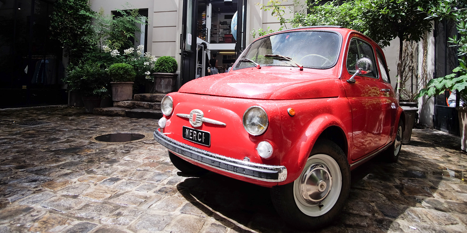 The iconic red Fiat at the entrance to Merci (photo by Tony )