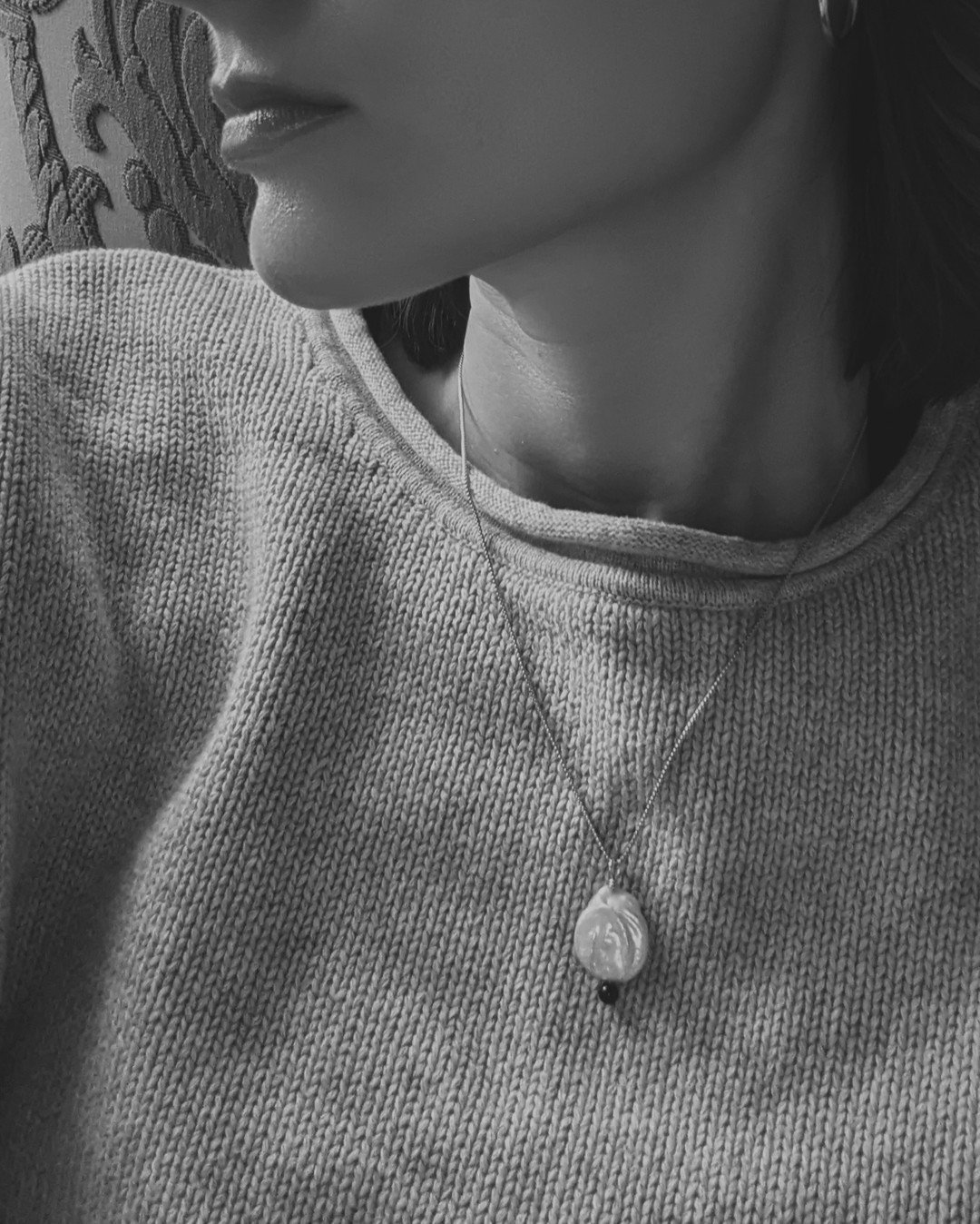 Wore the Pearl Amulet Necklace nearly every day of my honeymoon. Love the look of this necklace with a crewneck sweater 🖤