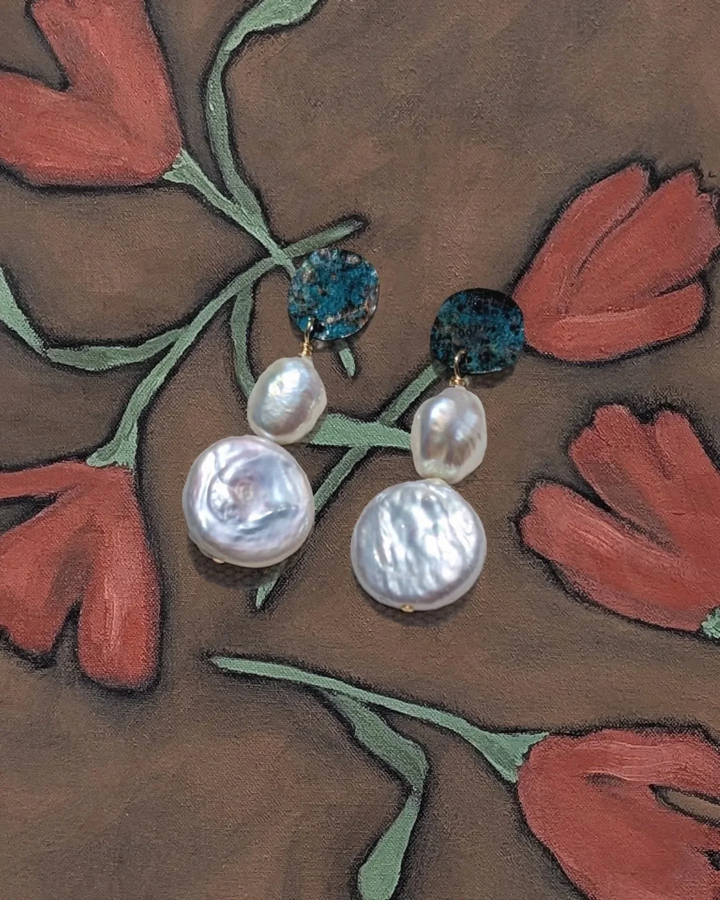 Perfect statement accessory ~ The Empress Earrings.
Irregular freshwater pearls suspended from brass discs cut, hammered, and patinated by hand, ensuring each pair is truly unique and special.
