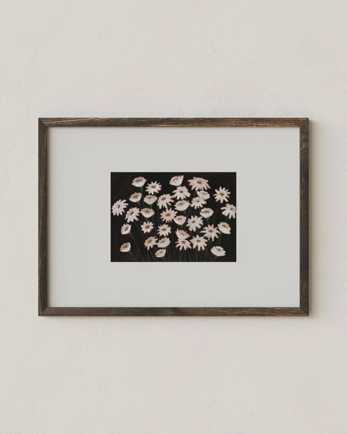 I love the look of a small art print in an oversized frame. The extra negative space created by the mat elevates the work by isolating any distractions and pulling the eye toward the center. It's my favorite way to display small pieces.
~&quot;Daisie