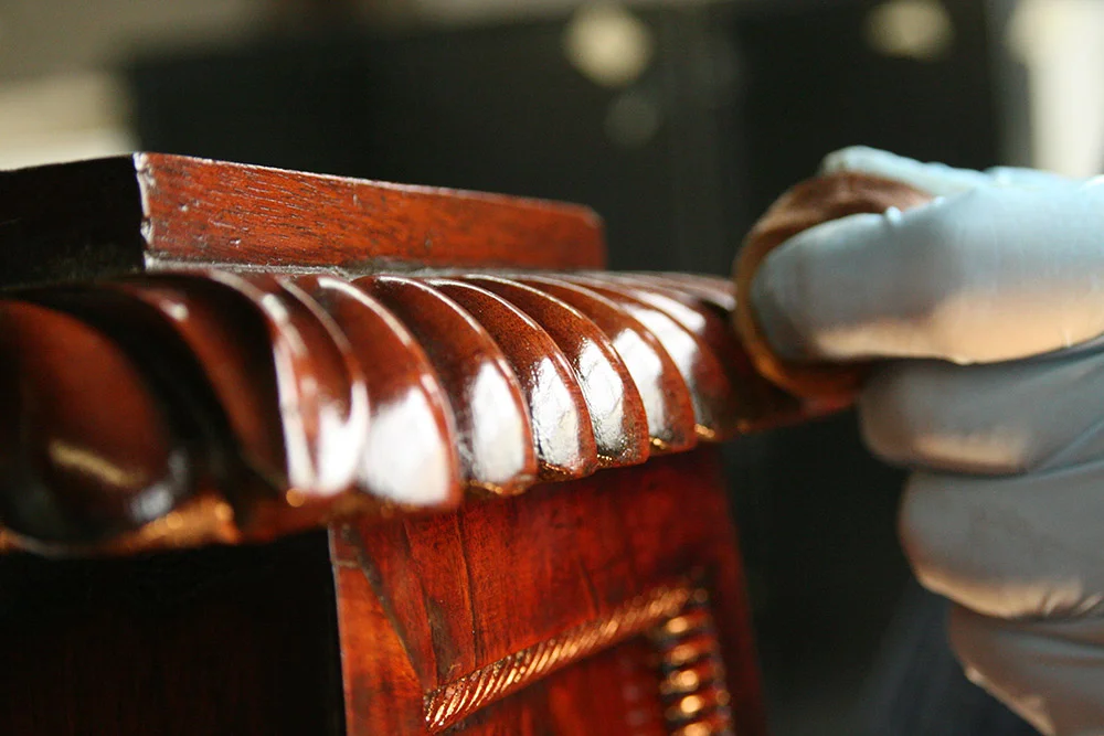 Applying shellac on the sideboard detail