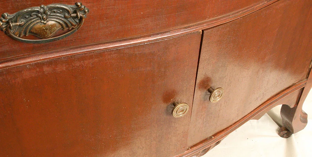 Detail before treatment; cross sanding and heavy over-painting are visible