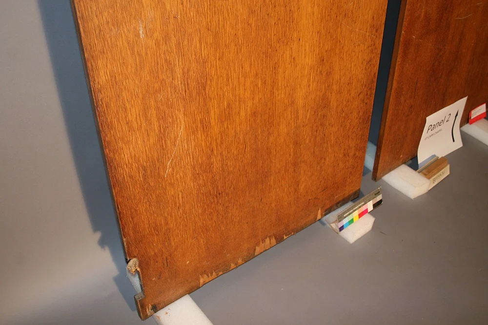 Veneered wall panel detail before restoration