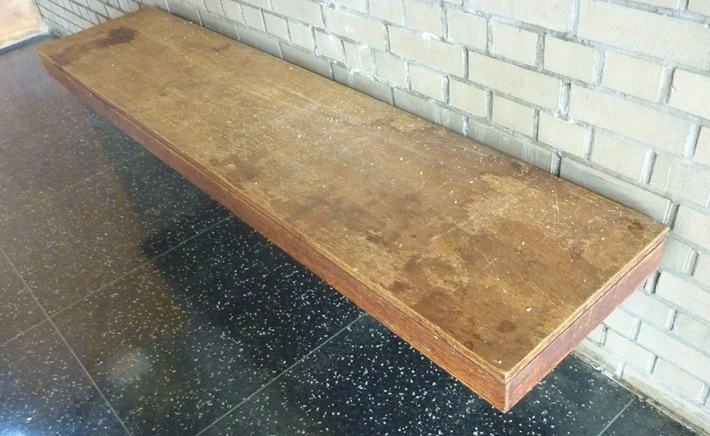 Veneered bench onsite before restoration