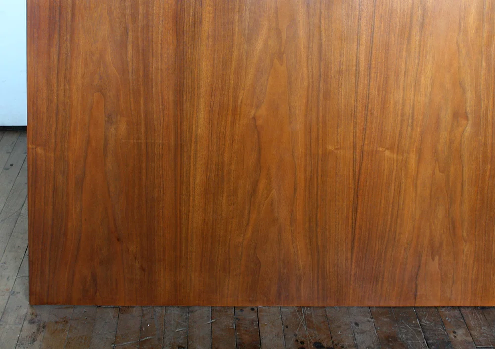 A water damaged panel portion, viewed before and after conservation
