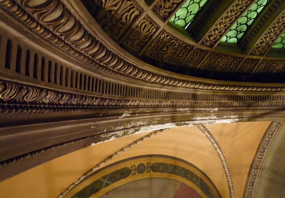 An area of missing plaster due to water leak