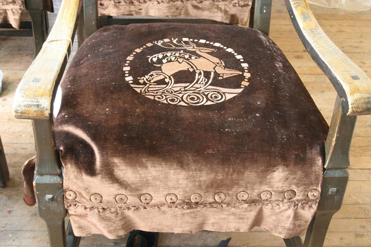 Careful removal of upholstery items to assess extent of damage to various materials