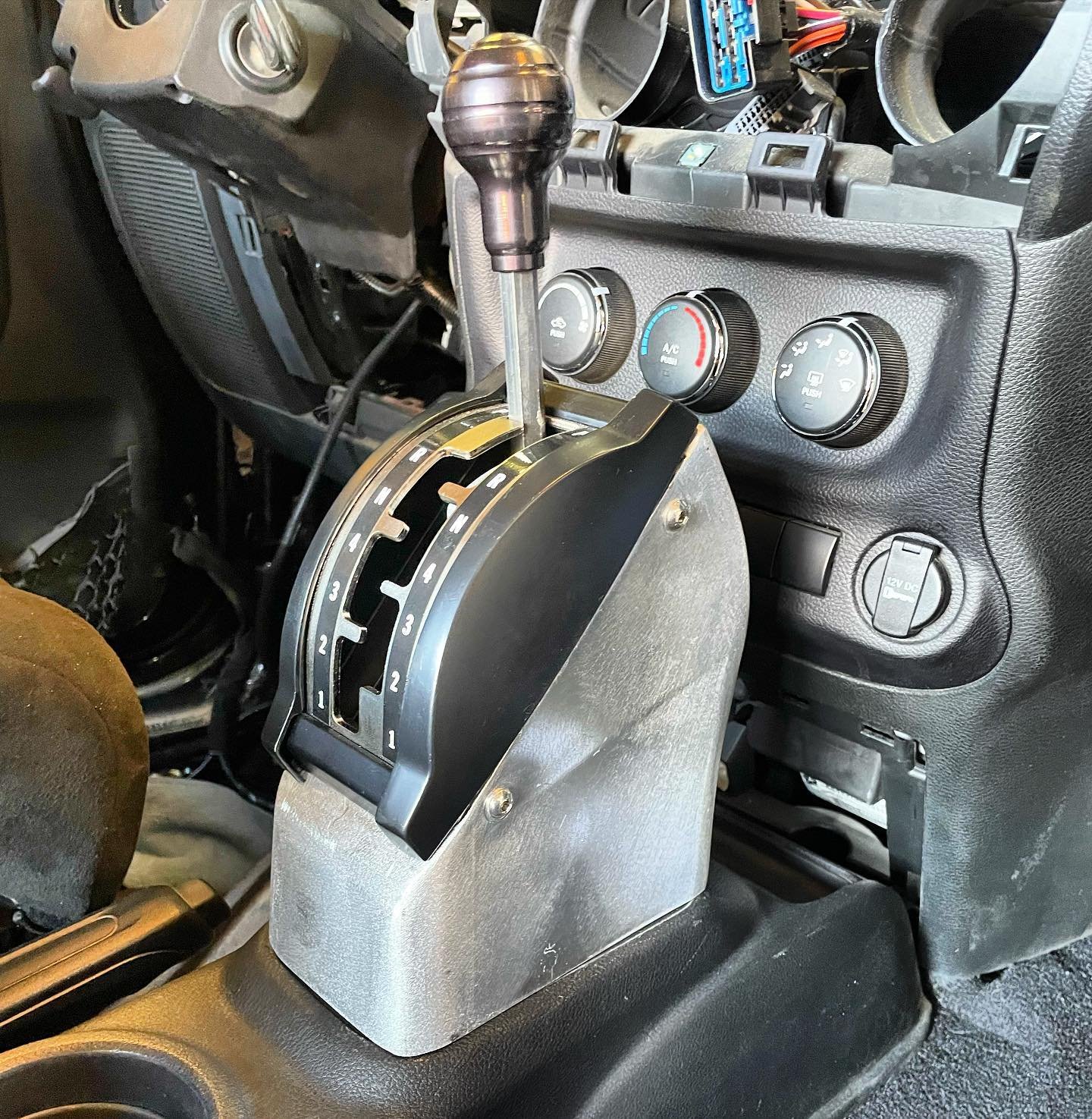 As we continue on @connormosack Jeep Wrangler unlimited build, @alldayfab got this slick shifter mount made for the 4l80e transmission this Jeep has.  It works with the factory center console and will be powder-coated a texture black to match the fac