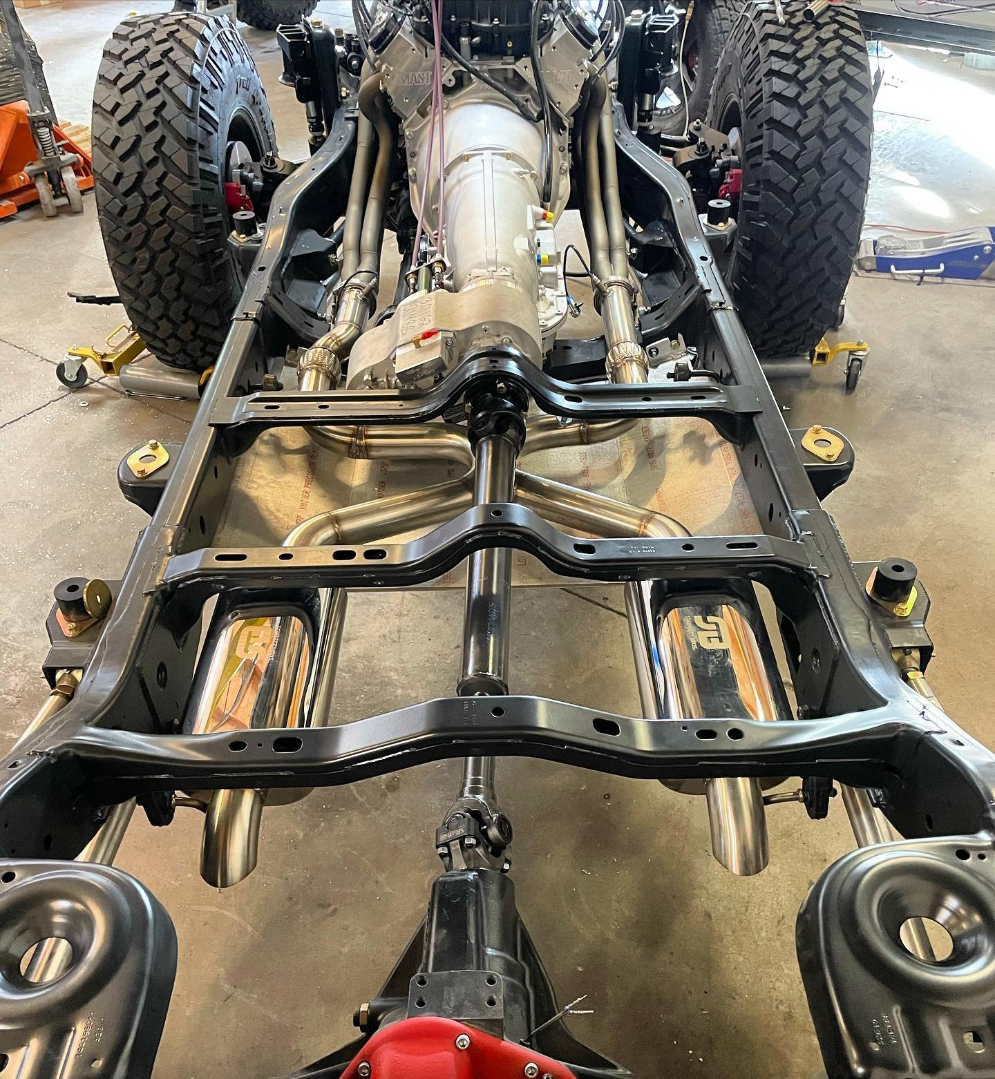 Nice overall shot of the Jeep Wrangler unlimited frame for @connormosack before we dropped the body back on.  With relocating the fuel tank to the rear using a @genrightoffroad kit, we were able to merge the exhaust right under the driveshaft.  Shoul