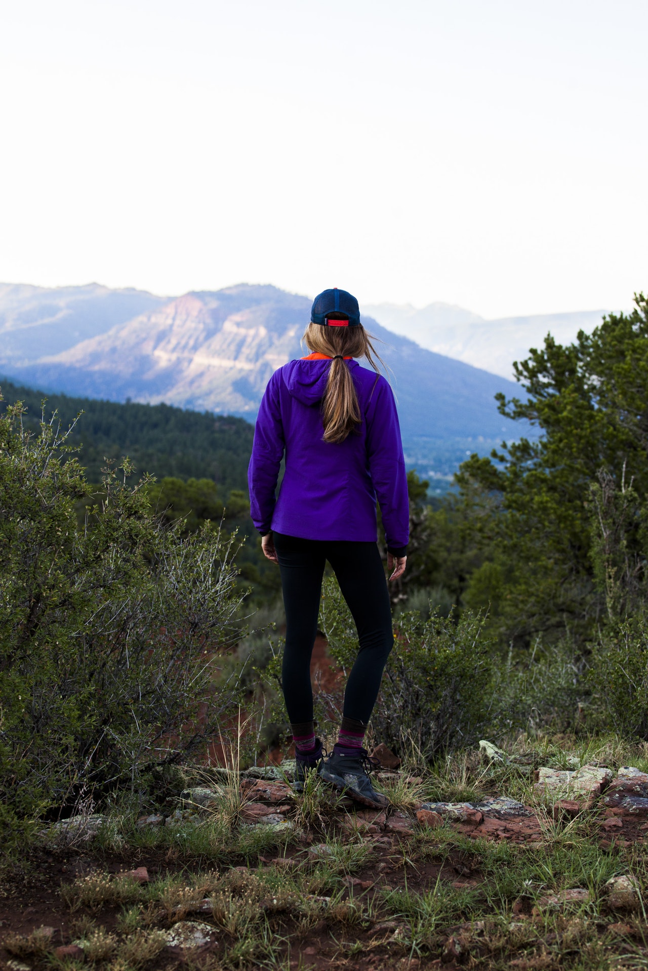 woman trail mountains.jpeg