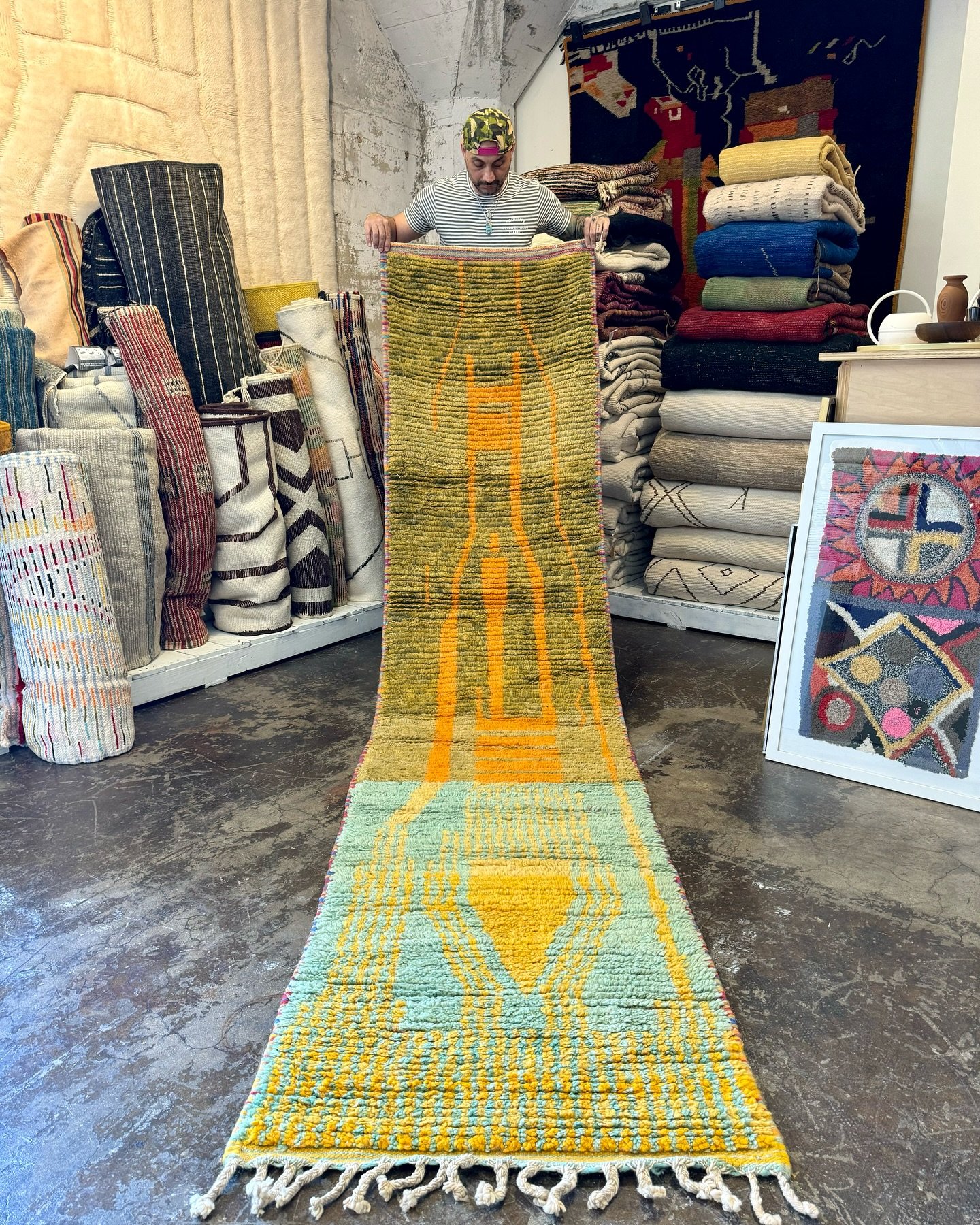 Vibrant contrasts, A stunning Boujad runner bringing together lush greens, warm oranges, and a pop of turquoise 😍. 
&bull;
#moroccanrugs #boujadrugs #berberrugs #interiordesign #chicdecor #bohostyle #runnerrugs #madeinmorocco🇲🇦 #ruglove #home