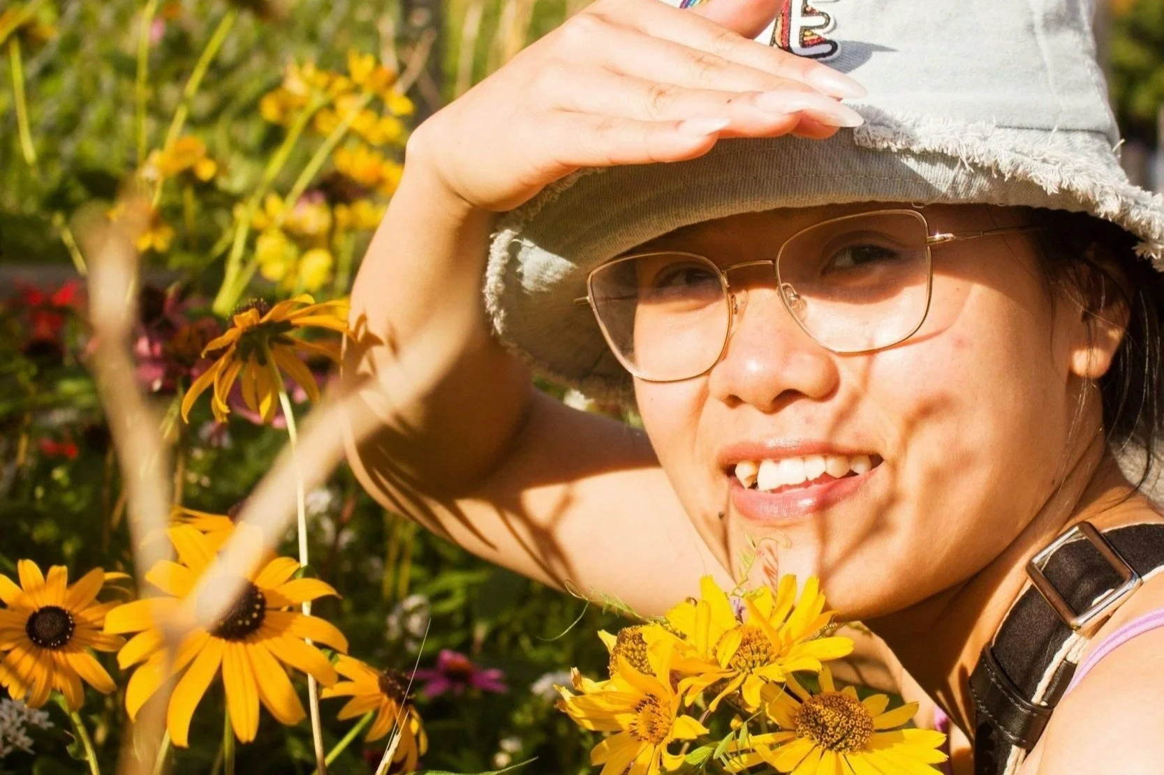 Woman in a bed of sunflowers