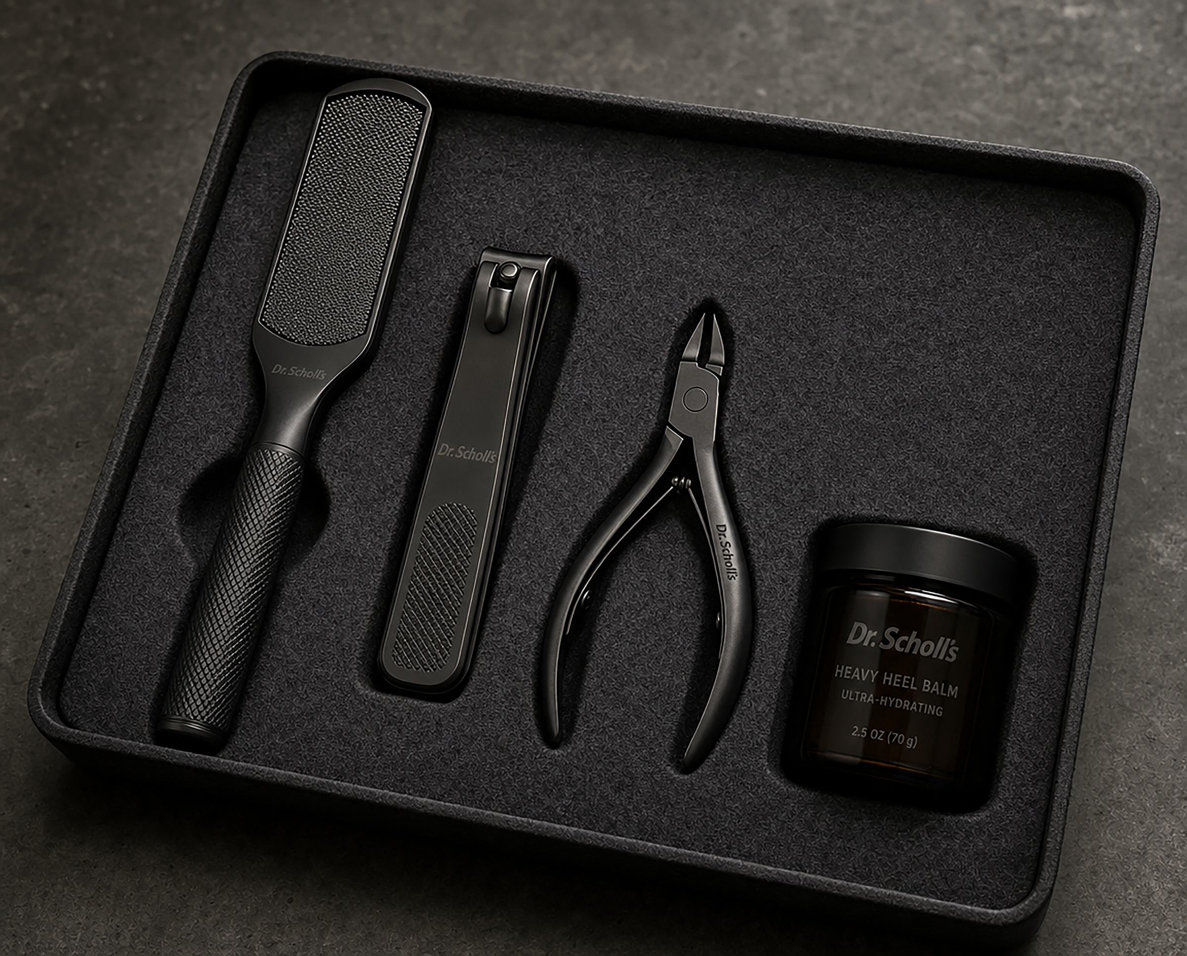 Speculative mockup of Dr. Scholl's foot scraper, toenail clipper, and cuticle nipper that reads Dr. Scholl's on the handle. Also a brown glass jar that reads Dr. Scholl's heavy heel balm, ultra-hydrating, 2.5 ox (70g).