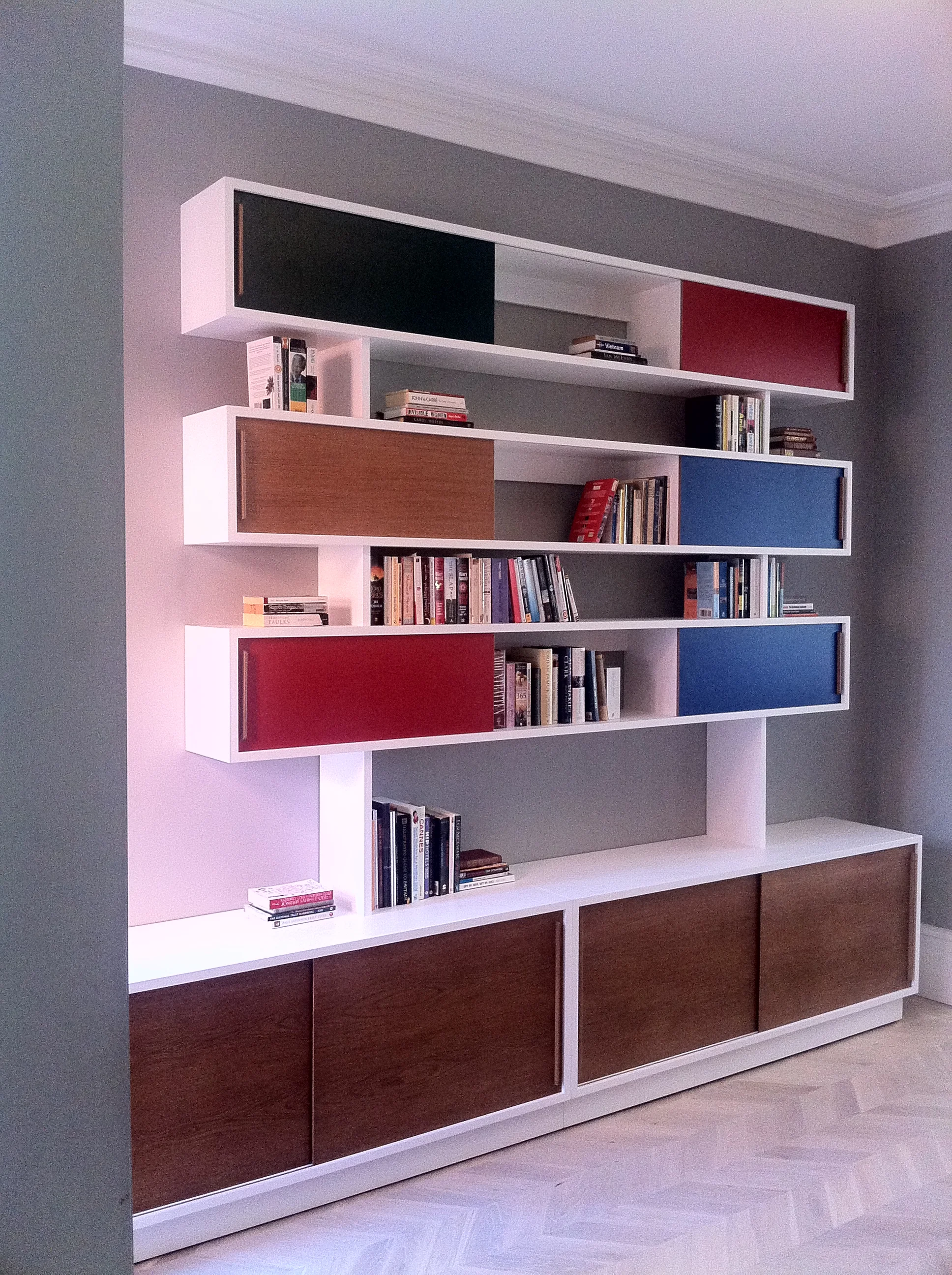 Sideboard rises into bookcase