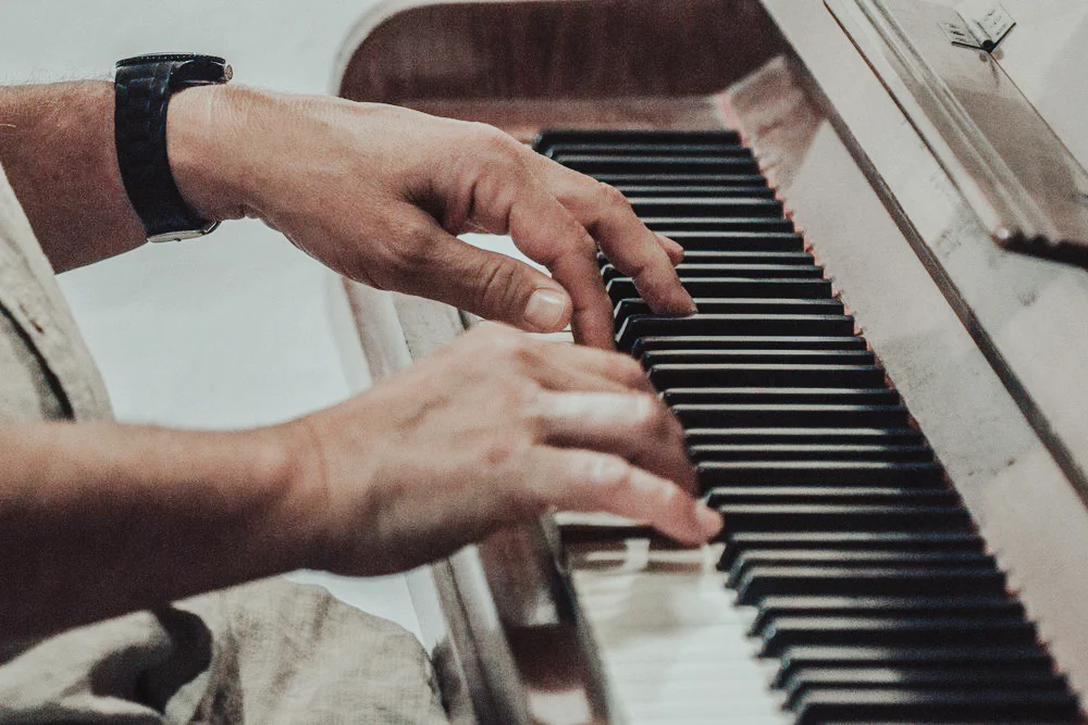 Camille_On_Piano.jpg